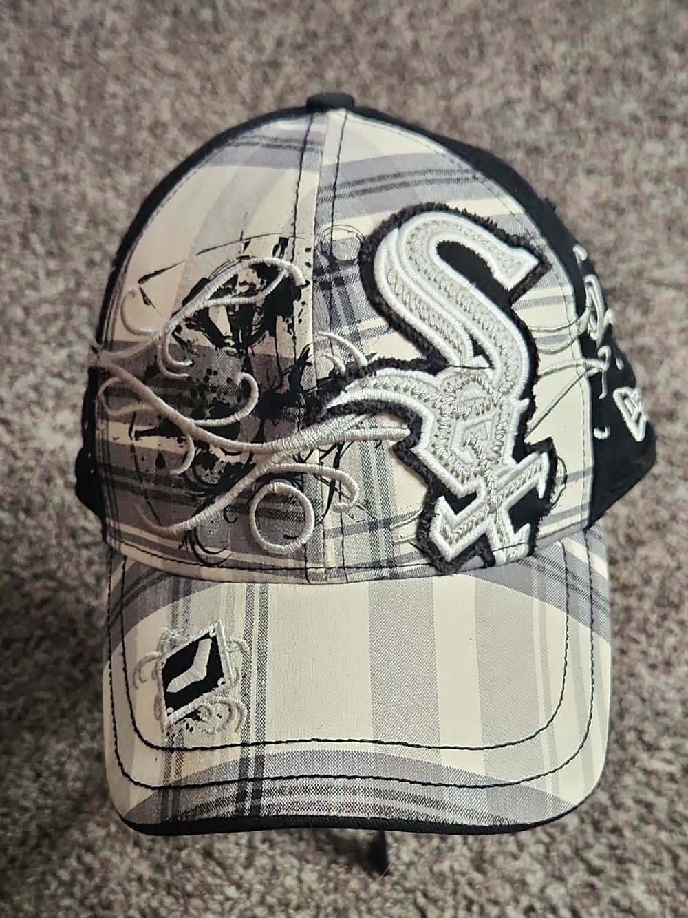 New Era Black and White Plaid Baseball Cap with Embroidered Logo